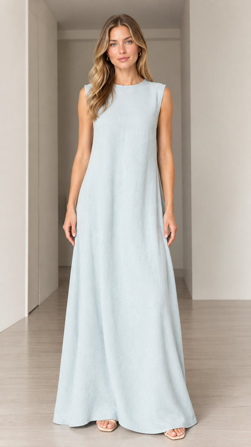 Front view of woman wearing Light Blue sleeveless crewneck A-line maxi dress