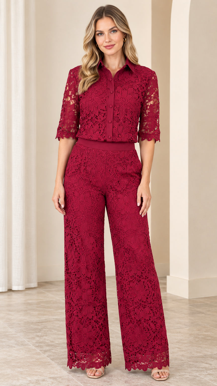 Front full-length view of woman wearing burgundy floral lace collared wide-leg jumpsuit
