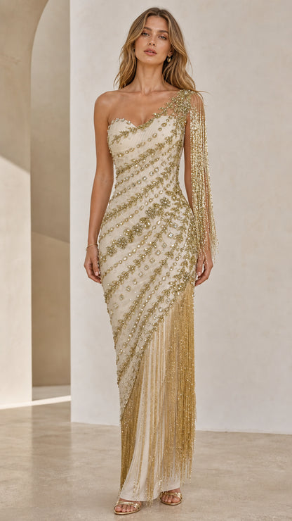 Front view of model wearing champagne one-shoulder beaded fringe gown