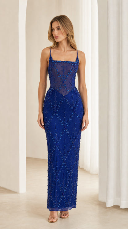 Front view of model wearing Royal Blue beaded corset maxi gown