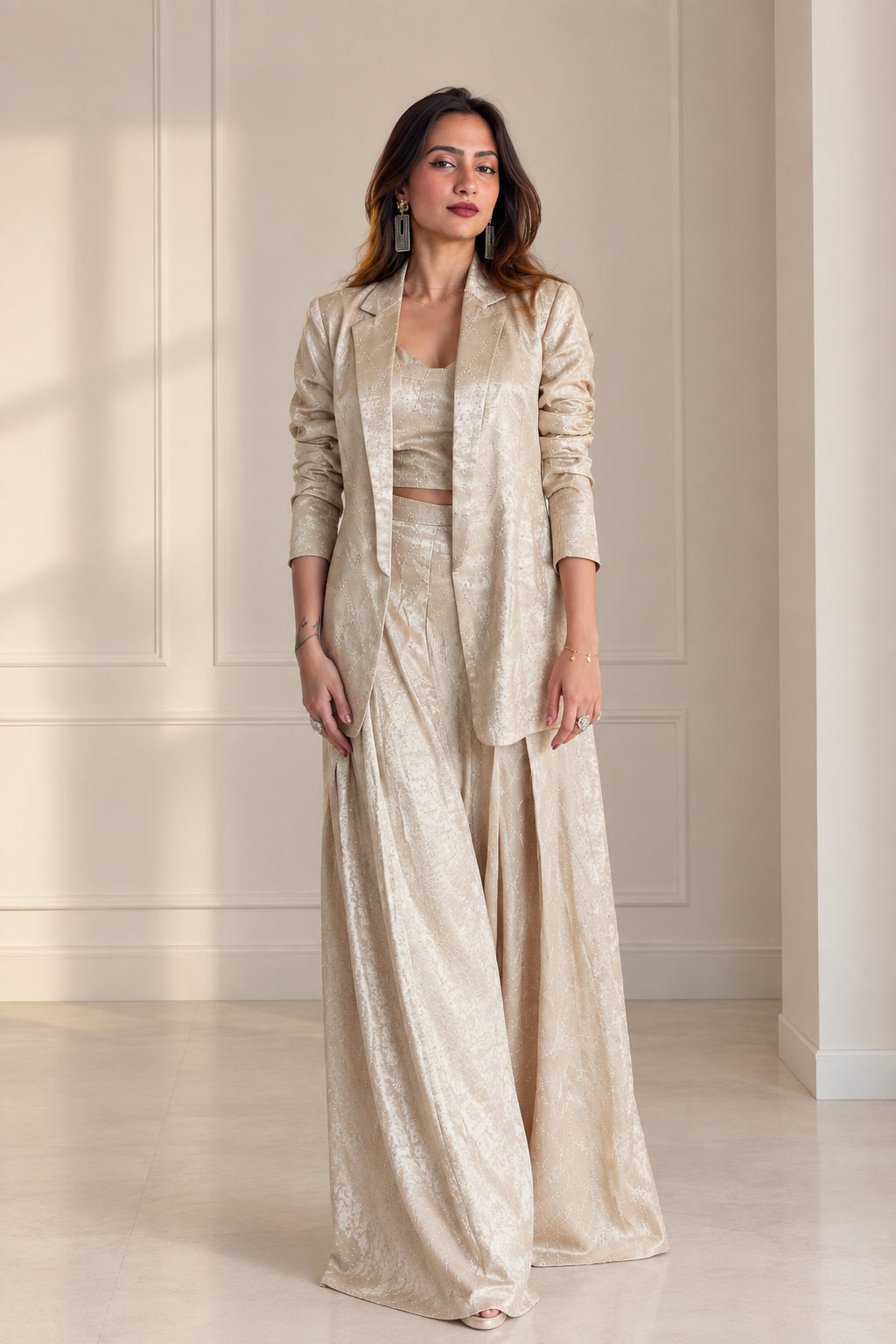 Front view of model wearing Champagne 3-piece textured jacquard suit set with blazer, crop top, and wide-leg pants