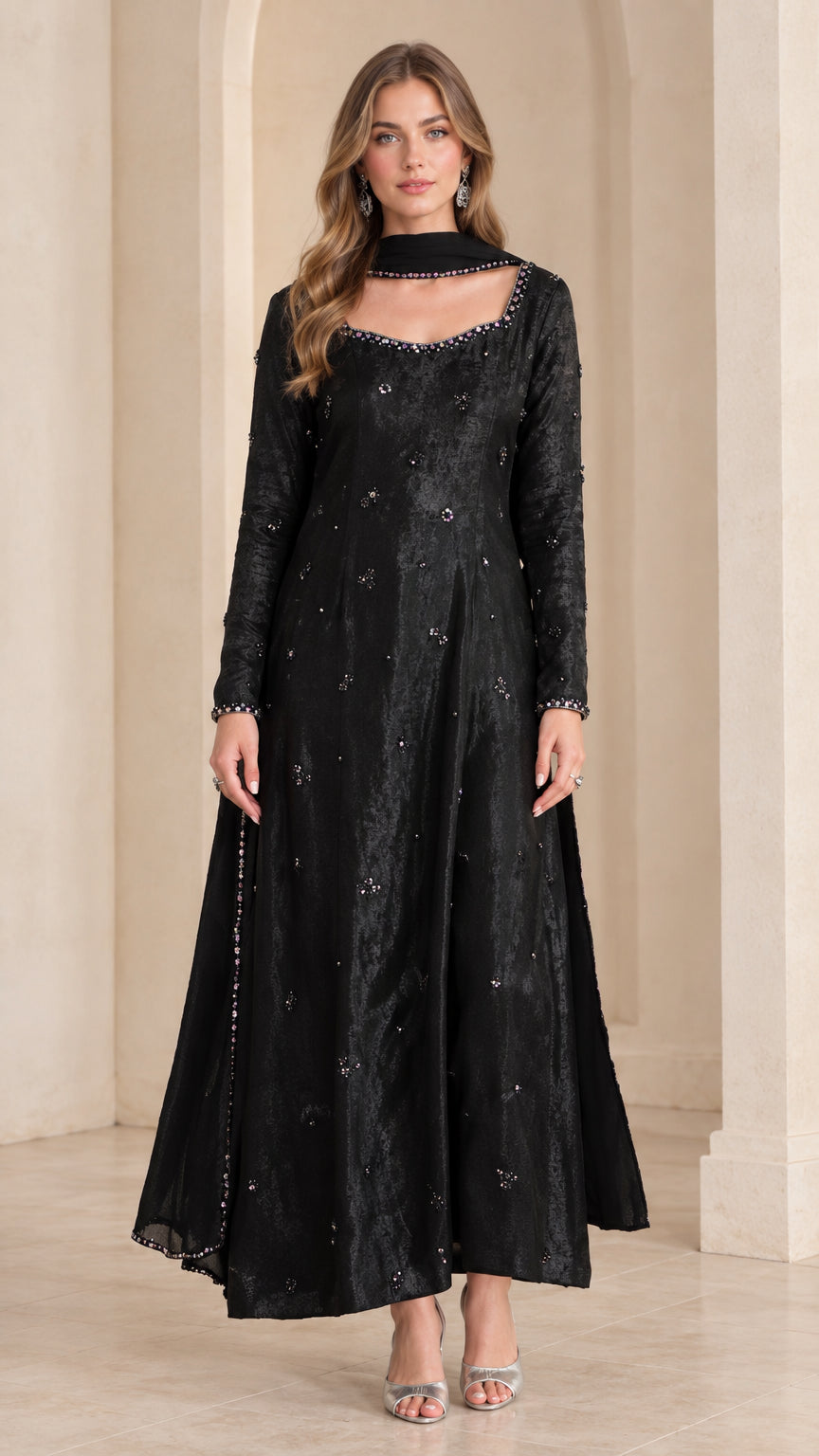 Front view of woman wearing black embellished long sleeve maxi Anarkali gown with matching scarf