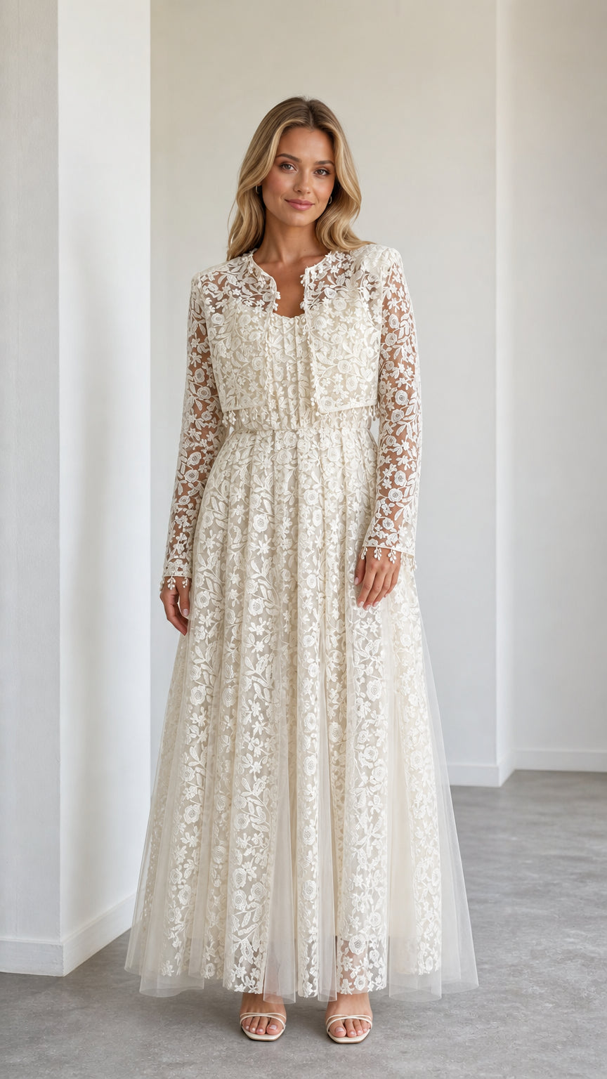 Front view of model wearing ivory floral lace maxi dress with cropped jacket
