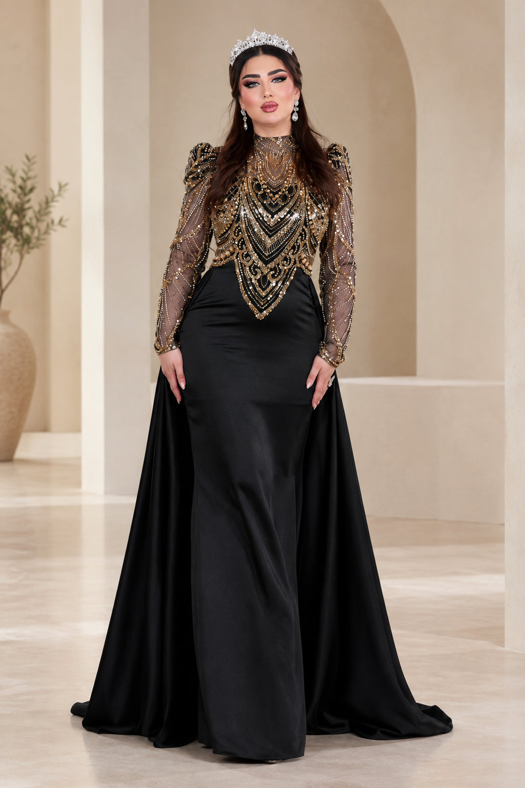 Front full view of black formal evening gown with beaded gold bodice and satin overskirt