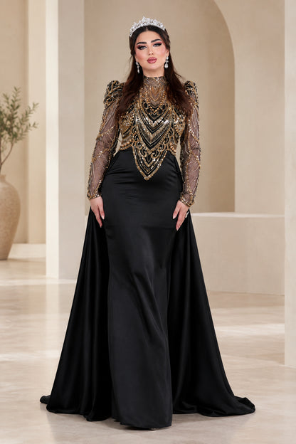 Front full view of black formal evening gown with beaded gold bodice and satin overskirt