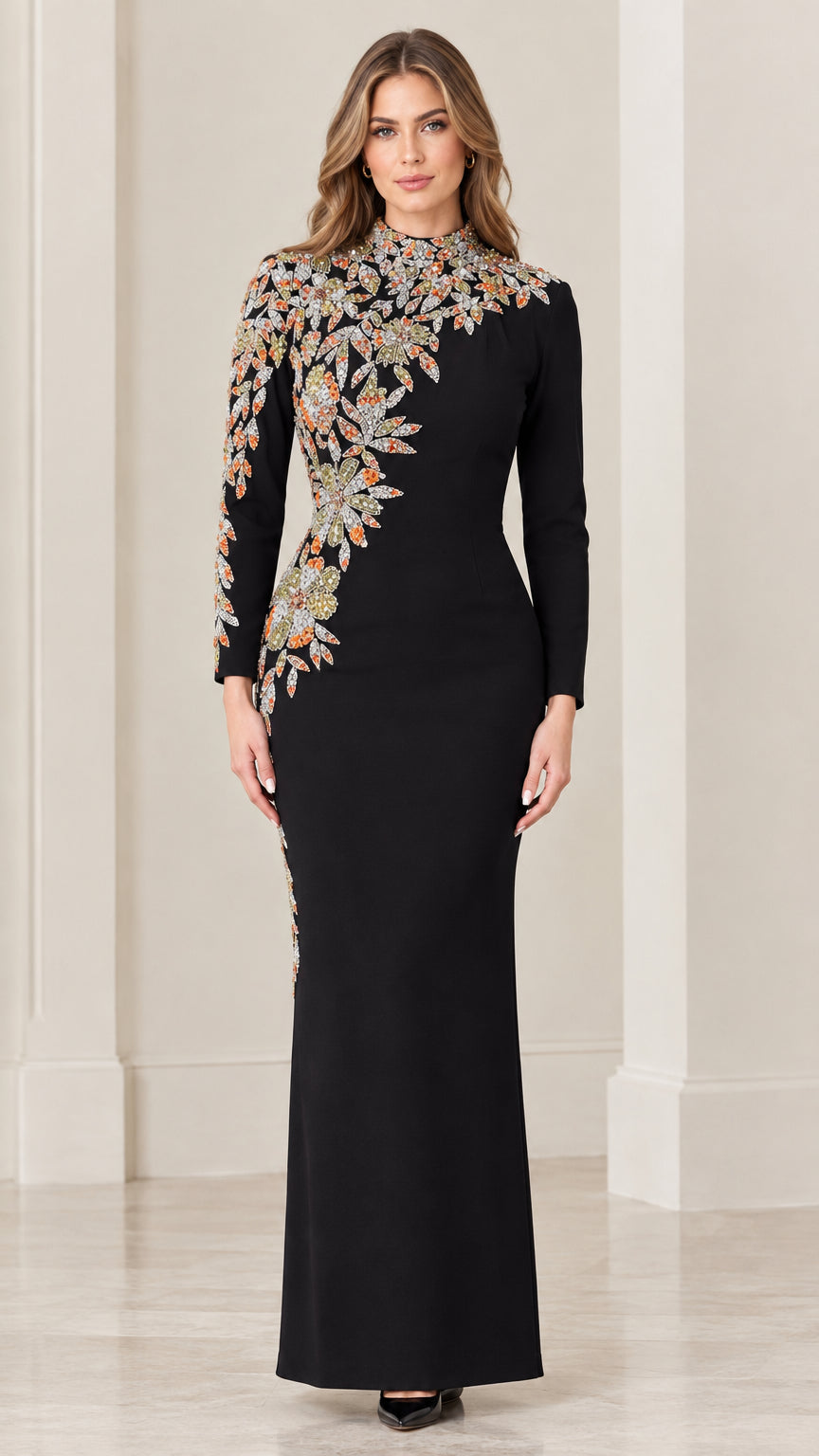 Front view of black long sleeve evening gown with asymmetrical floral embroidery