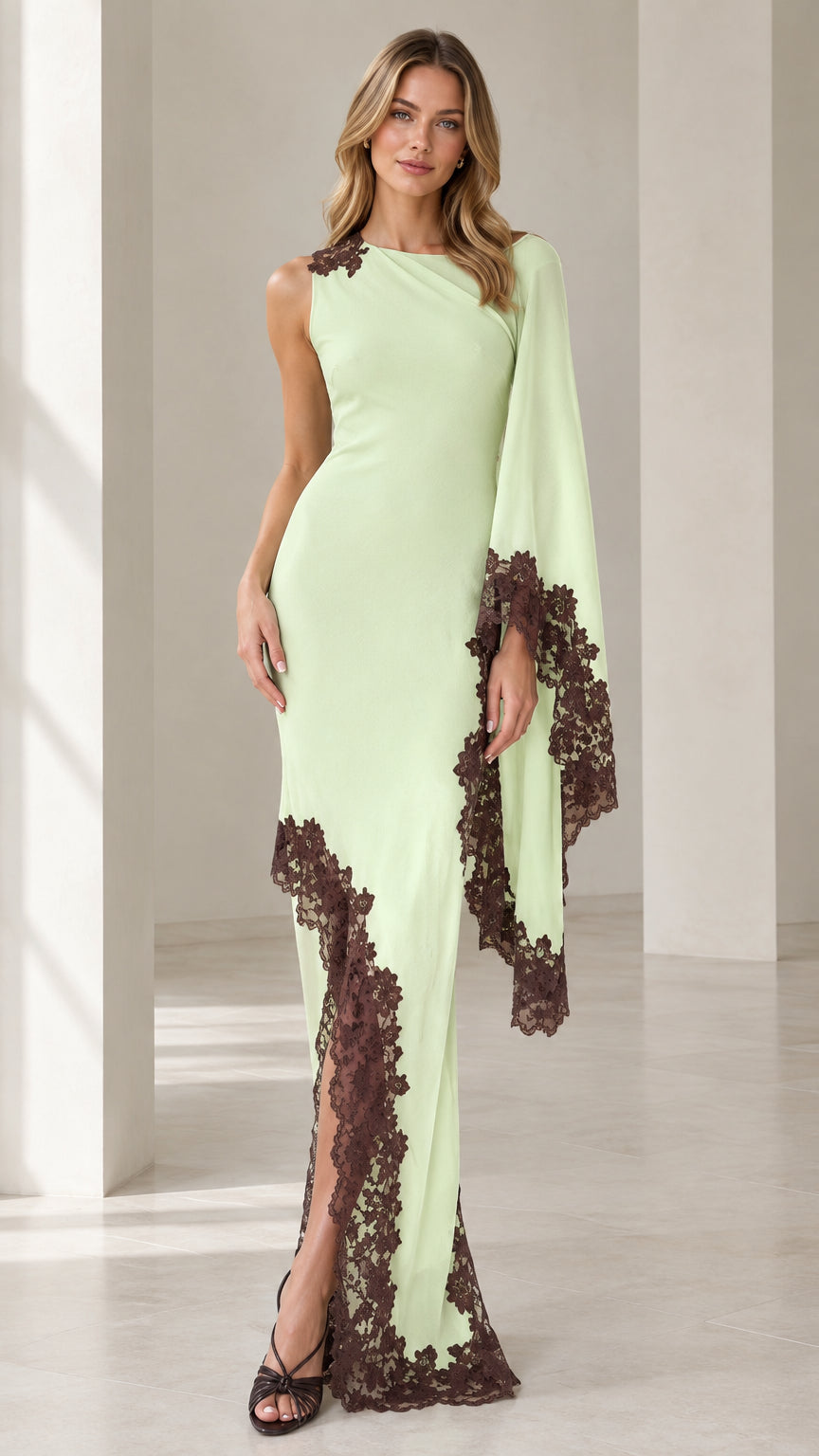 Front view of woman wearing mint green asymmetric cape sleeve maxi dress with contrast brown lace trim