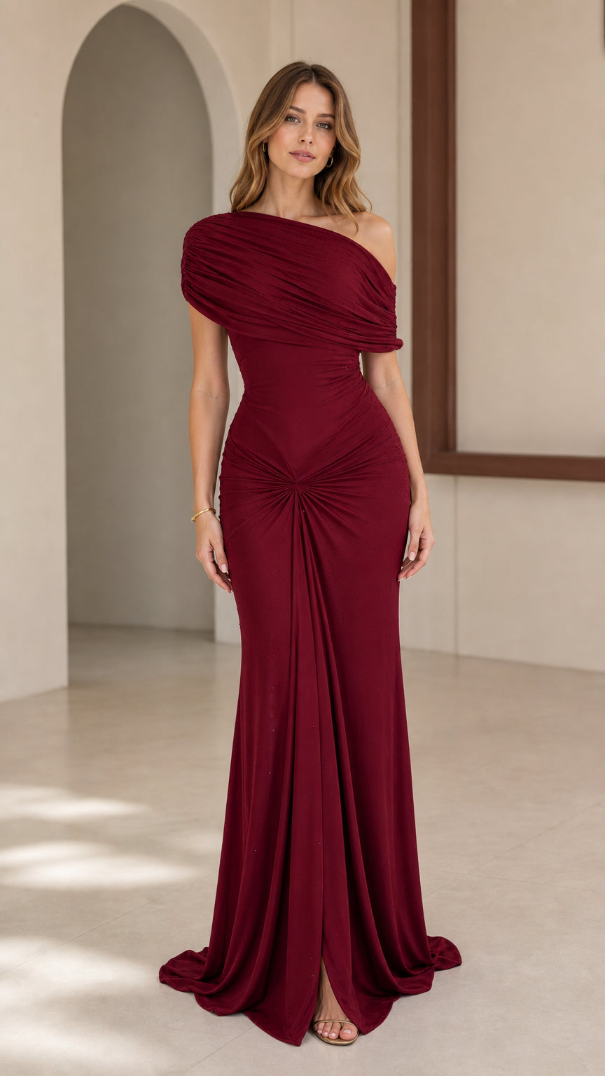 Model wearing Burgundy one-shoulder ruched evening gown, front view