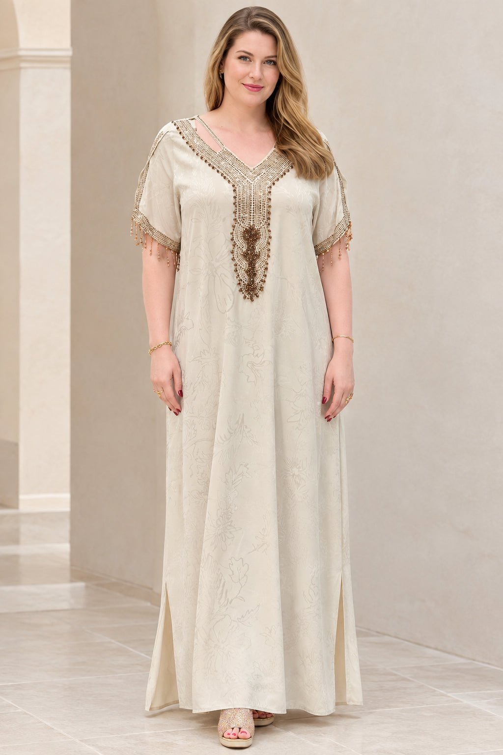 Front view of model wearing champagne beaded jacquard kaftan maxi dress