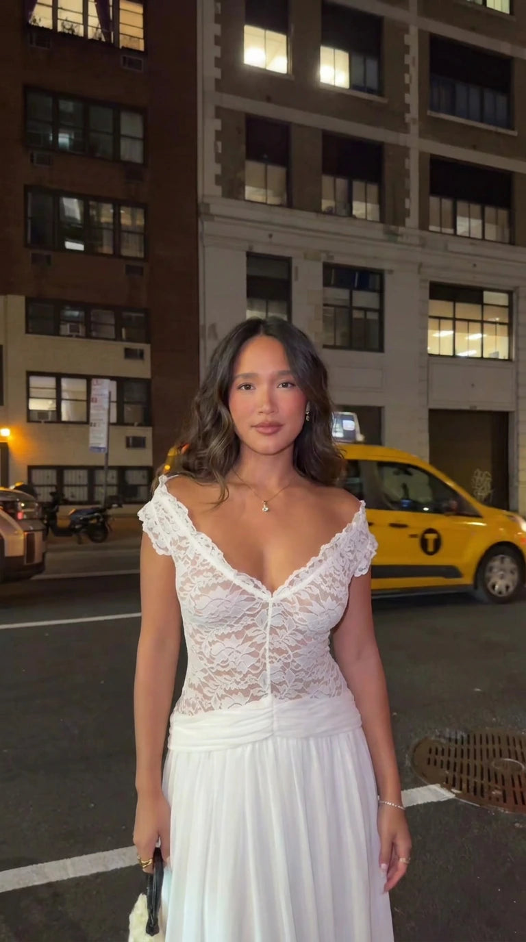 Woman wearing white lace scalloped V-neck maxi dress front view