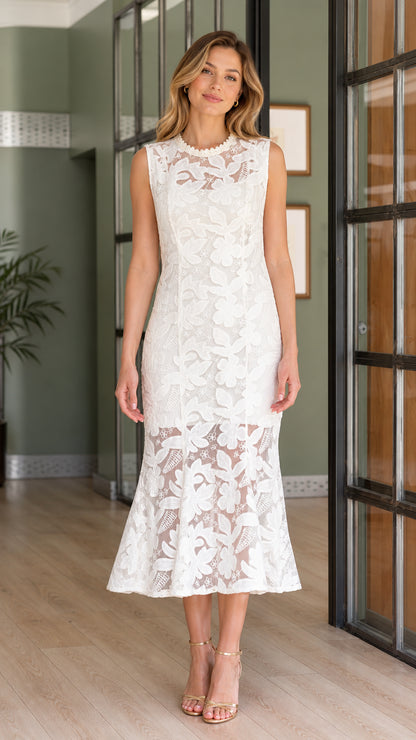 Front view of model wearing white sleeveless floral lace mermaid midi dress with beaded neckline