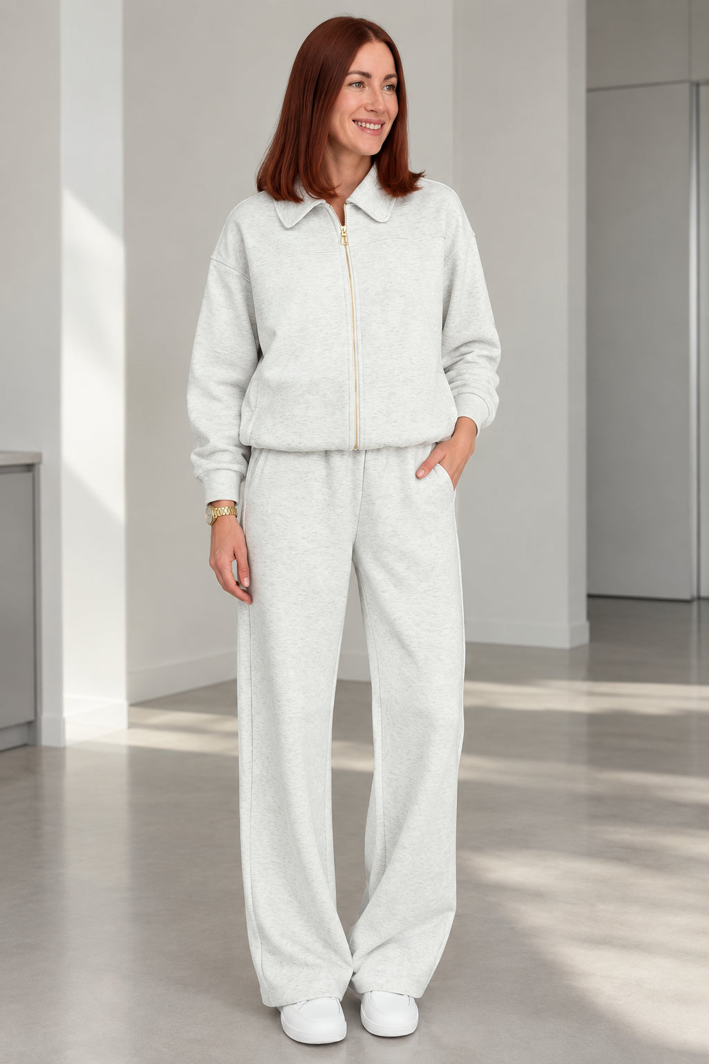 Front view of woman wearing Heather Grey collared zip-up lounge set with wide-leg pants