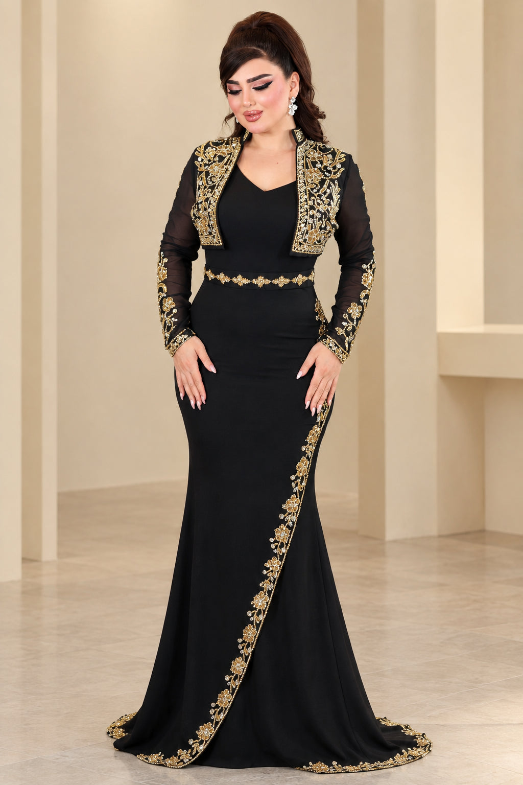 Front view of black formal evening gown with gold embroidery and matching cropped jacket