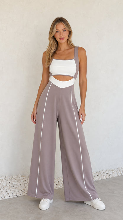 Full front view of model wearing dusty mauve colorblock cutout wide-leg jumpsuit