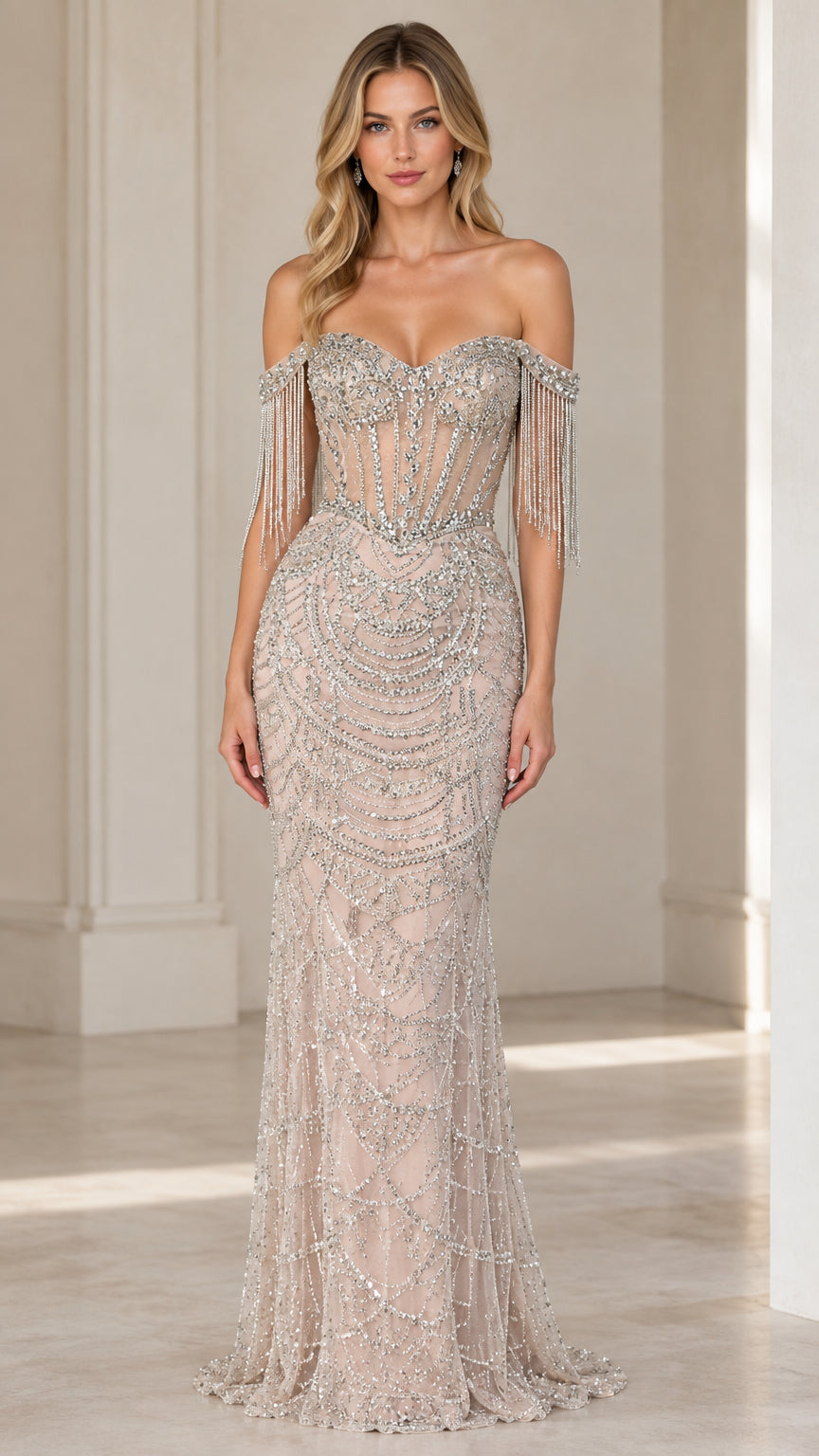 Front view of champagne beaded off-shoulder mermaid evening gown with fringe details