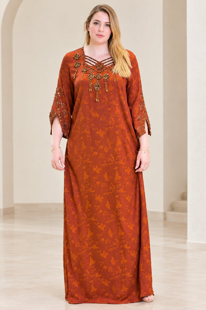 Front view of woman wearing rust orange beaded strappy V-neck kaftan maxi dress