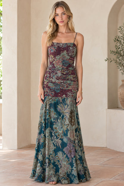 Front view of model wearing burgundy multi floral ruched spaghetti strap maxi dress