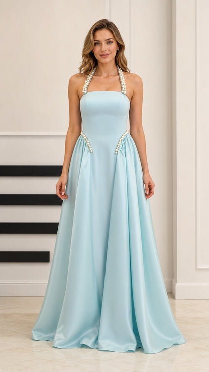 Front view of model wearing a light blue satin A-line evening gown with pearl halter straps