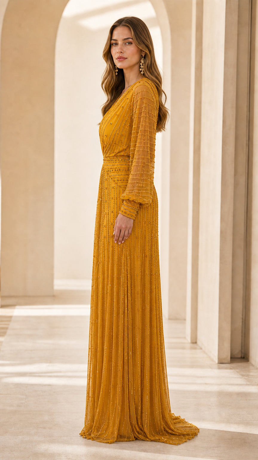 Side profile of model in mustard yellow maxi dress