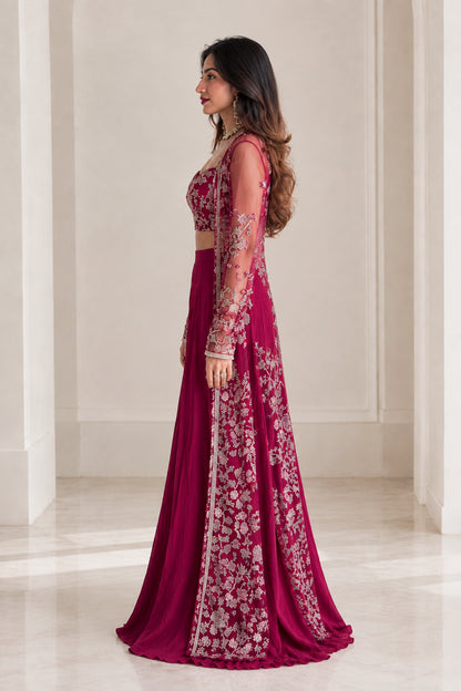 Side profile view of model wearing magenta embroidered 3-piece palazzo set with long cape