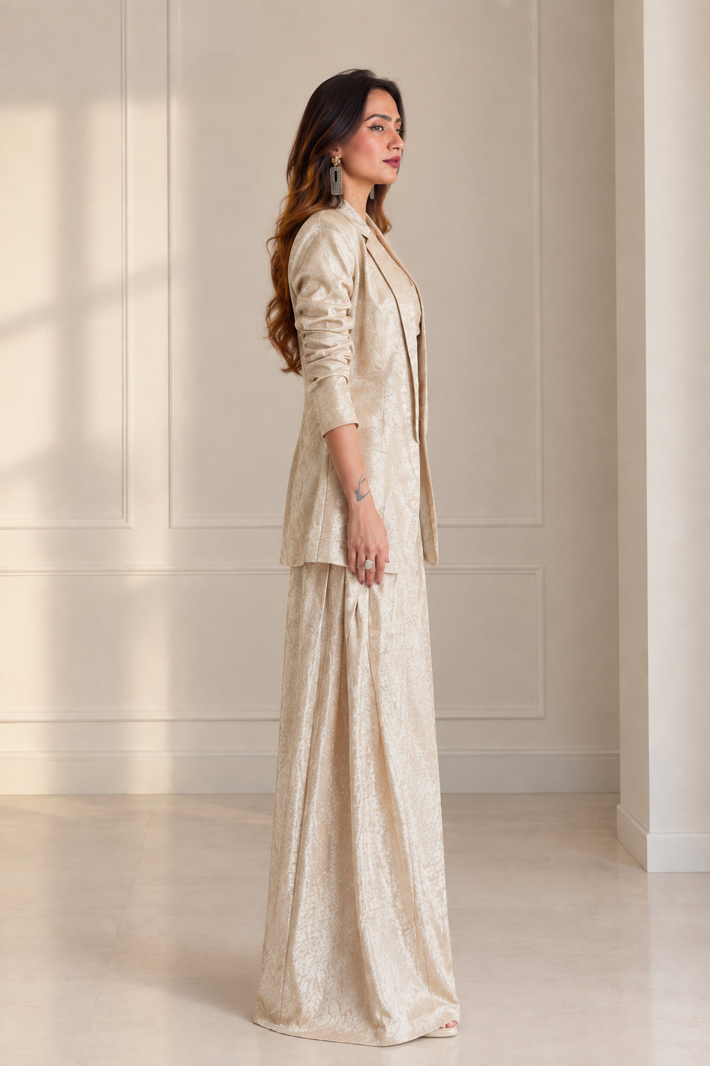 Side profile view of model wearing Champagne 3-piece jacquard pant suit set