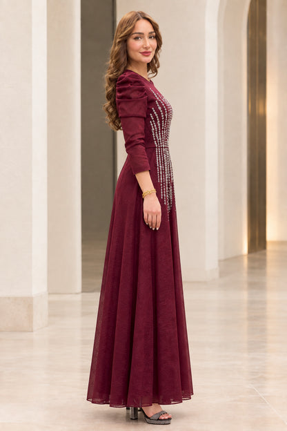Side angle view of burgundy long sleeve embellished A-line evening dress