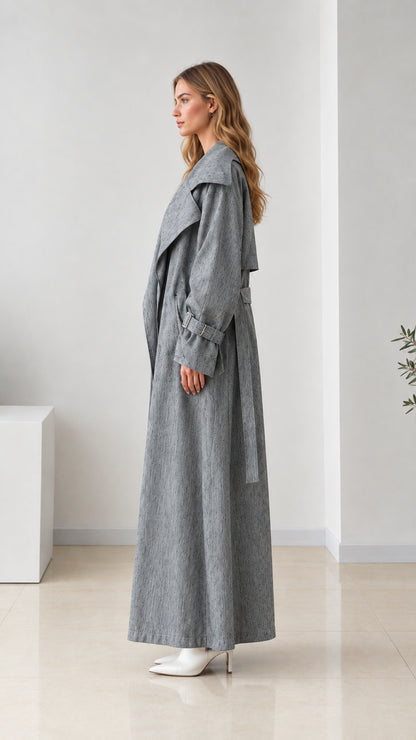 Side profile of women's grey full-length duster coat