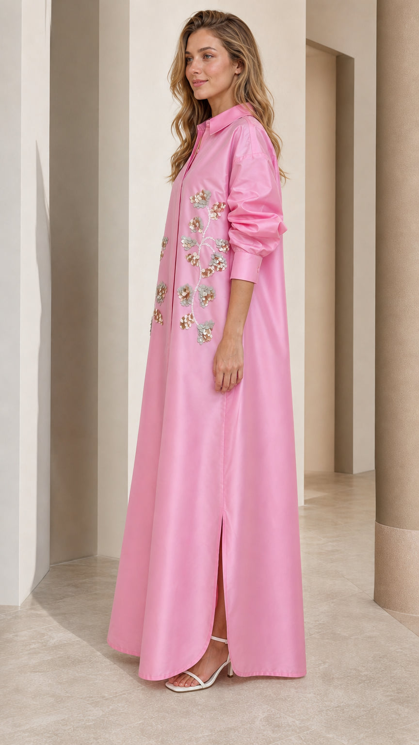 Side full view of woman wearing pink sequin embroidered maxi shirt dress