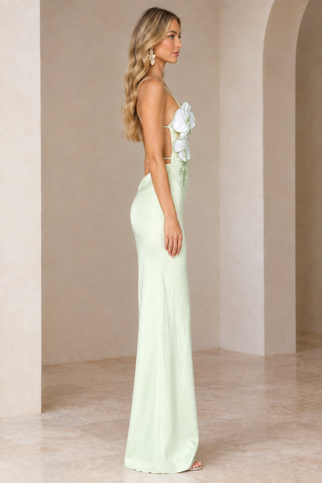 Side view of Mint Green backless maxi dress highlighting the silhouette