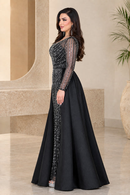 Side profile of black beaded column gown with voluminous satin overskirt