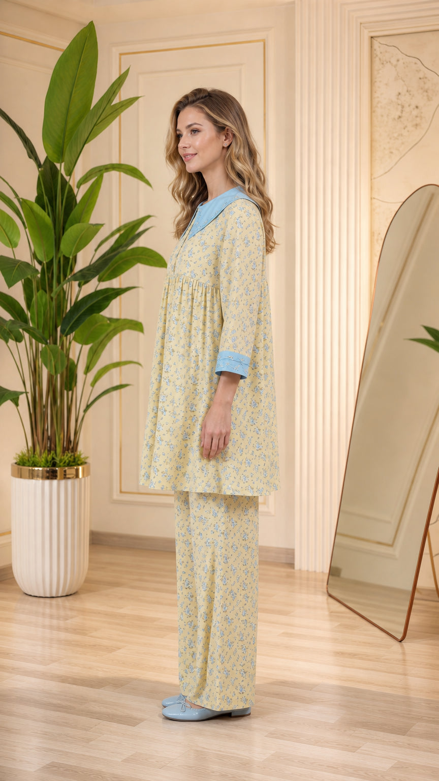 Side view of model in pastel yellow floral tunic pajama set