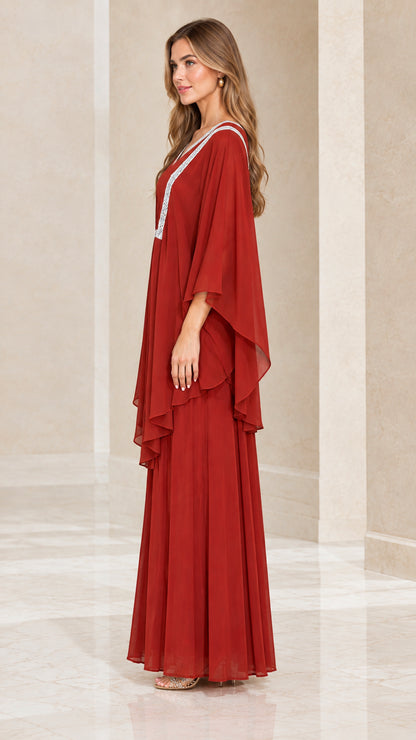 Side profile view of rust red flowing chiffon layered kaftan maxi dress
