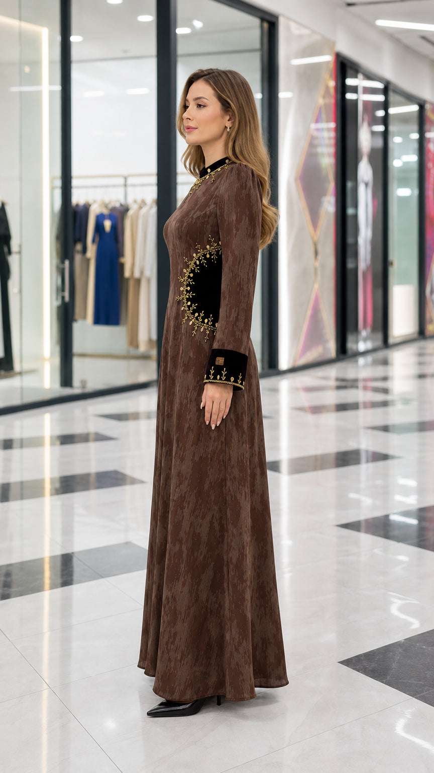 Side profile of brown embroidered long sleeve maxi dress