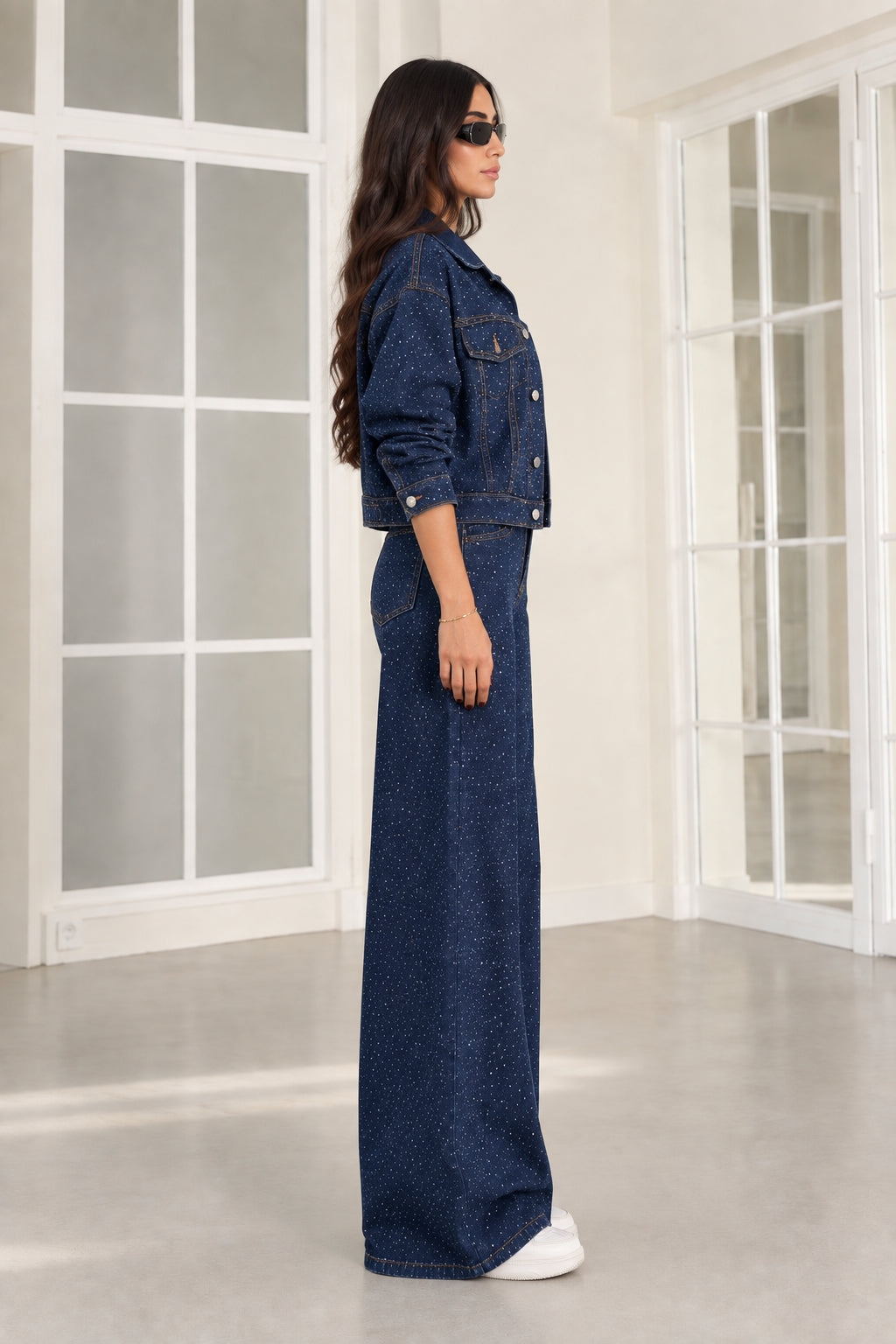 Side profile view of dark blue rhinestone denim matching two-piece set