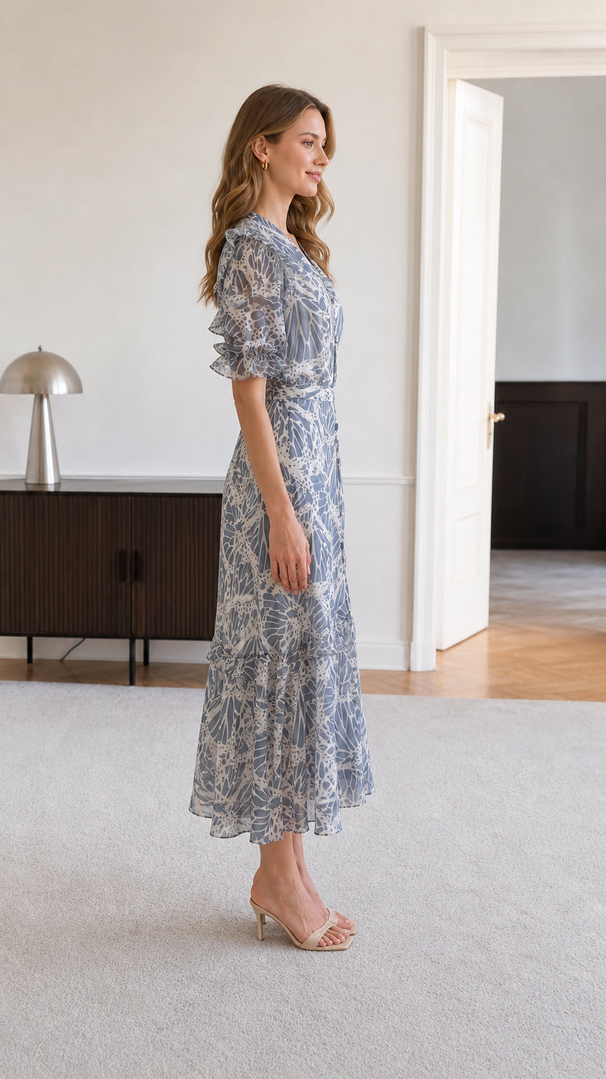 Side view of dusty blue botanical print flutter sleeve midi dress