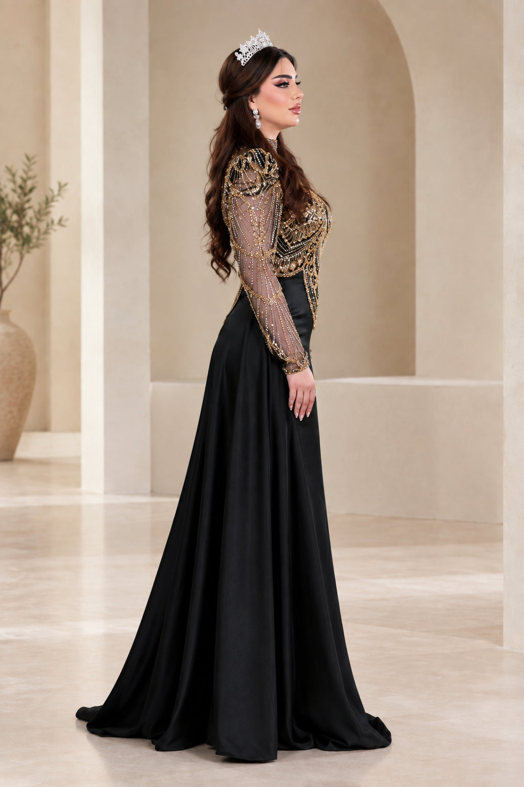Side profile view of black evening gown showing tailored fit and flowing train