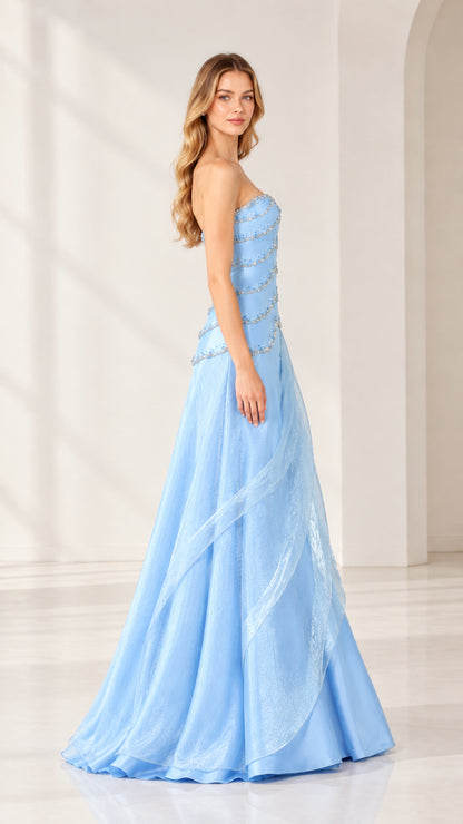 Side profile of strapless light blue formal gown showing cascading side draping