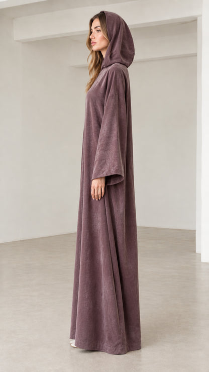 Side profile of women's dusty mauve hooded long sleeve abaya dress