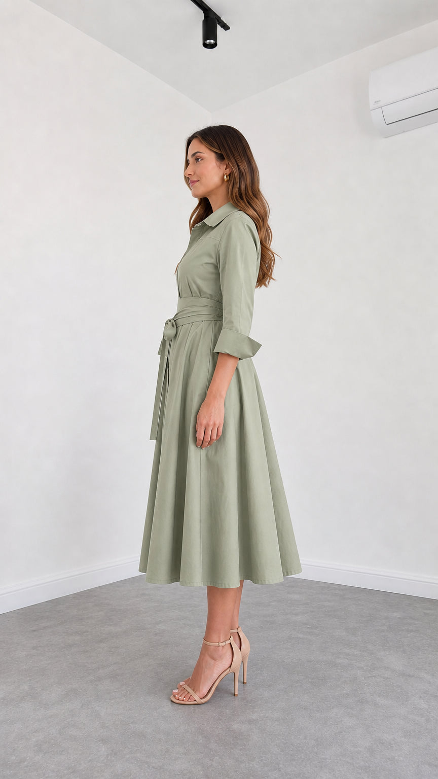 Side profile view of Sage Green collared midi dress with sash belt