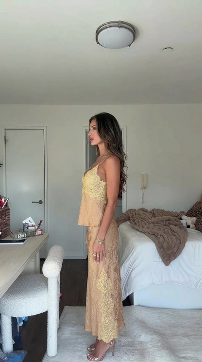 Side profile view of champagne gold lace cami and coordinating midi skirt