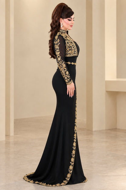 Side profile of woman wearing black floor-length embroidered evening dress