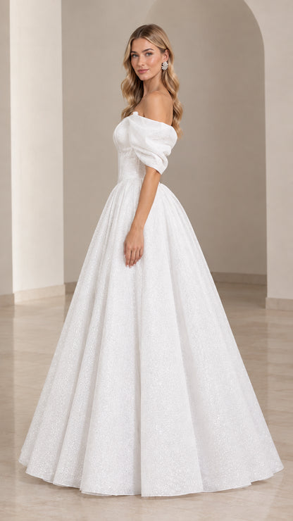 Side profile of white shimmering ball gown with puff sleeves