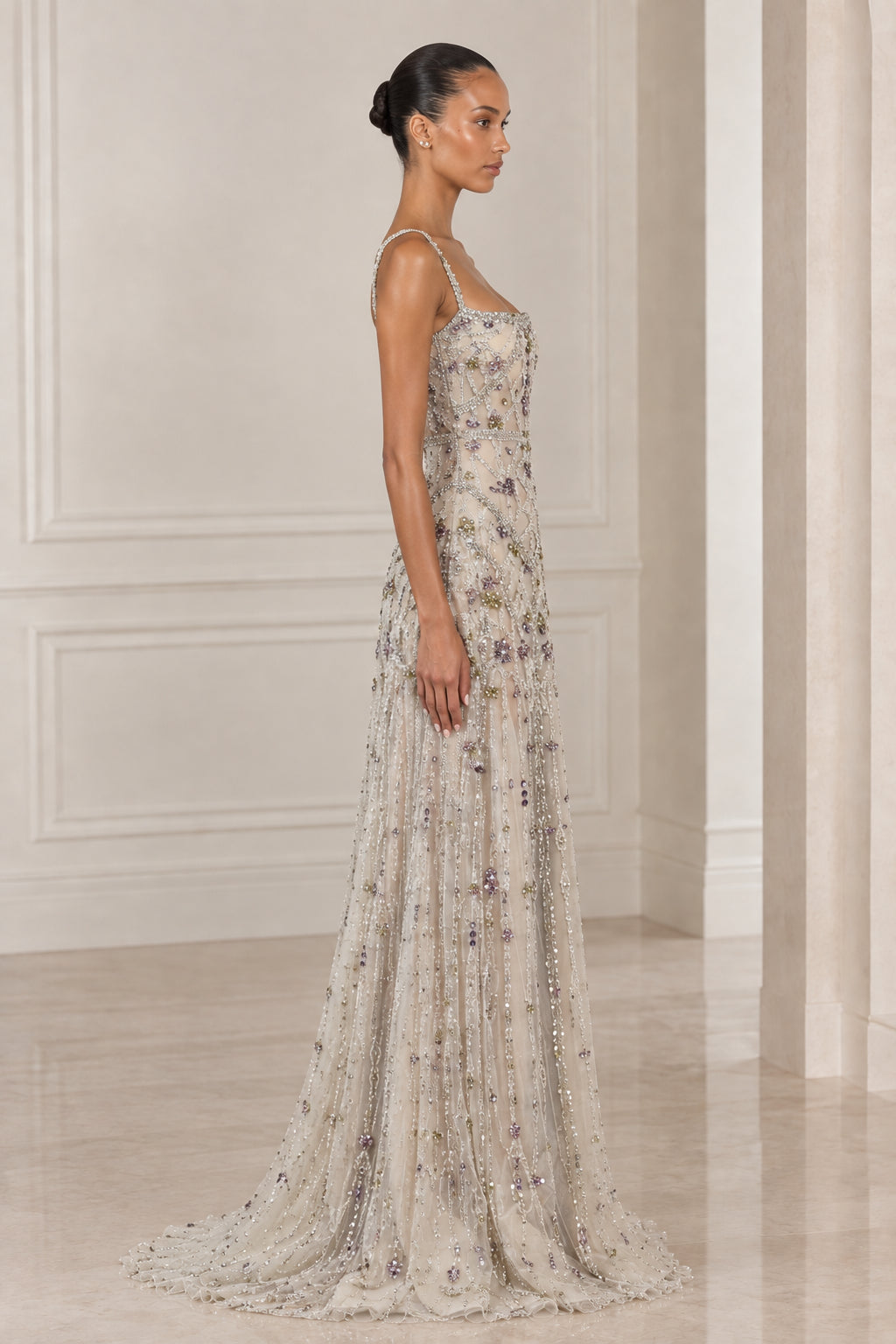 Side view of model in Silver Champagne crystal embellished maxi formal gown