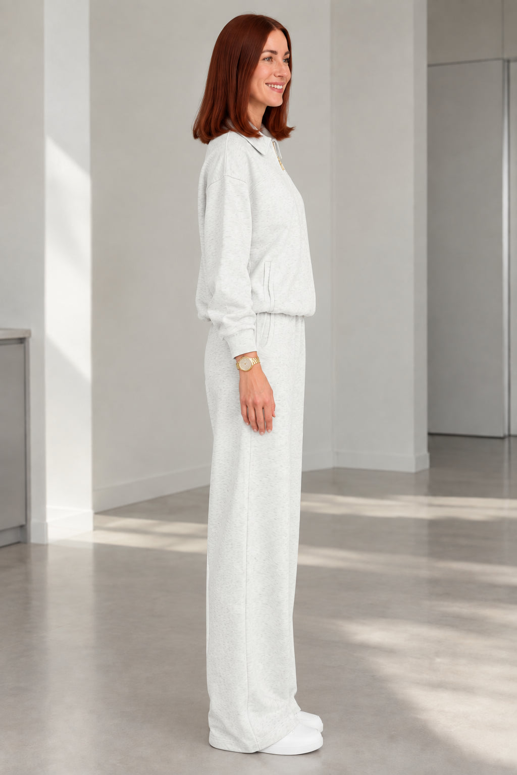 Side profile of woman in Heather Grey two-piece casual tracksuit