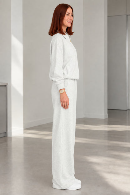 Side profile of woman in Heather Grey two-piece casual tracksuit