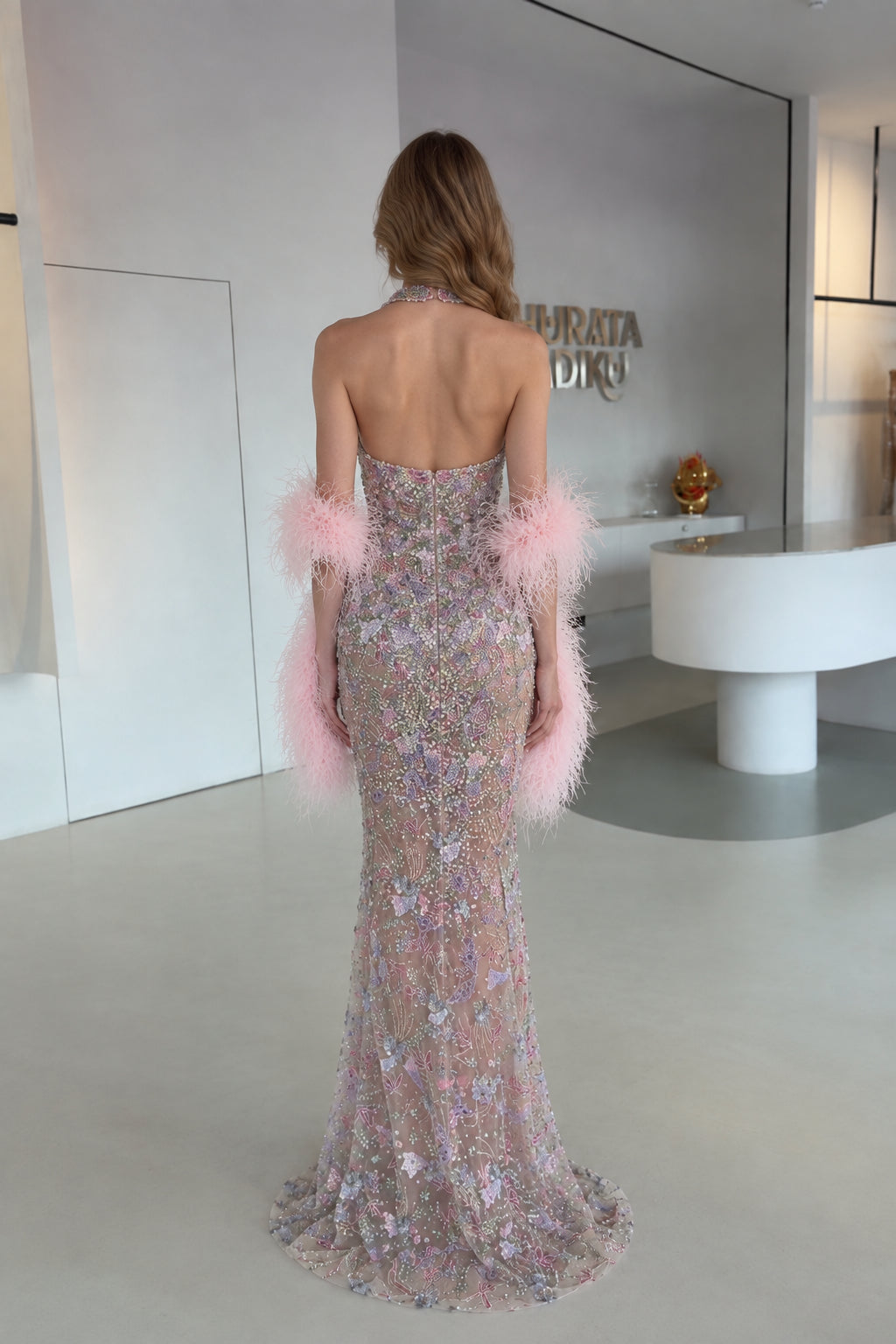 Back view of Blush Pink open back halter formal gown