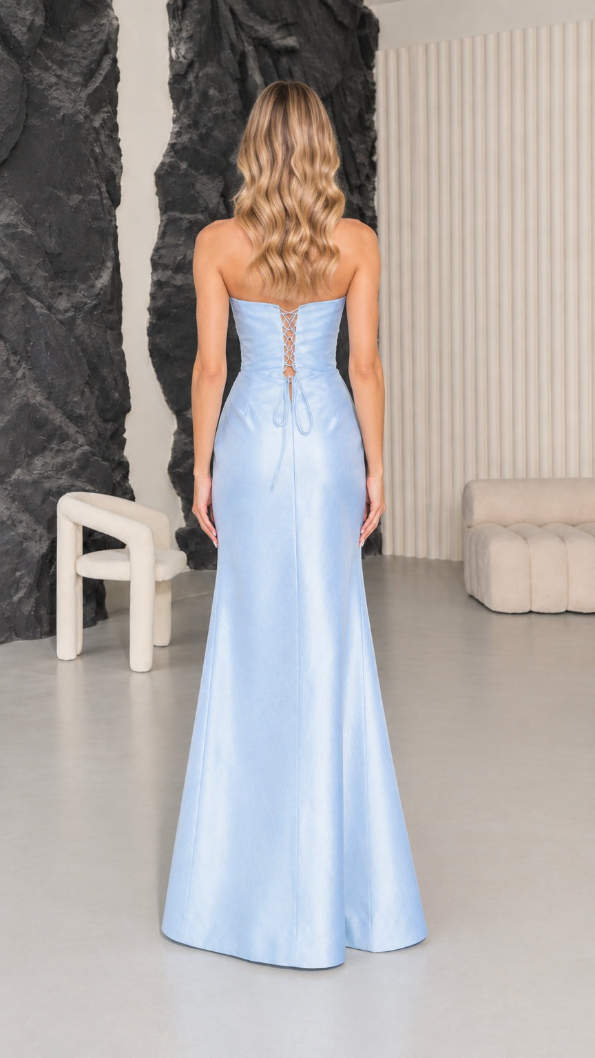 Back view of woman wearing Light Blue maxi dress highlighting lace-up corset detail