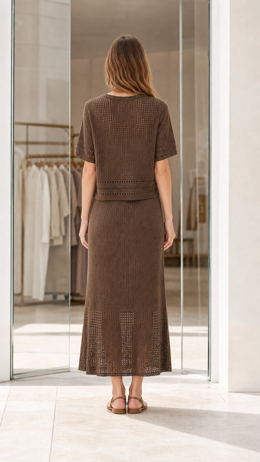 Back view of woman wearing brown two-piece knit co-ord skirt set