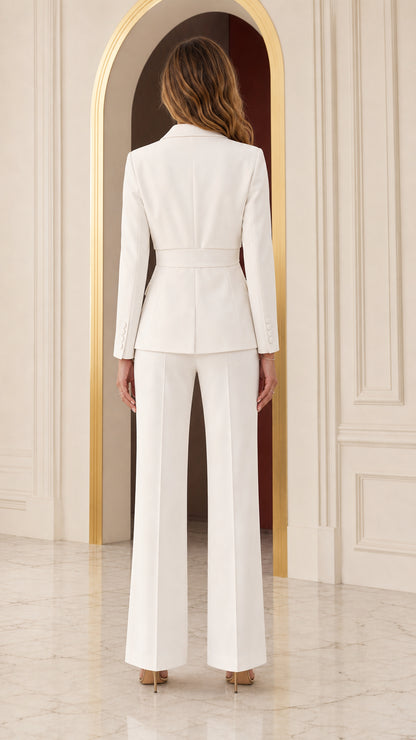 Back view of woman wearing white tailored suit jacket and wide trousers