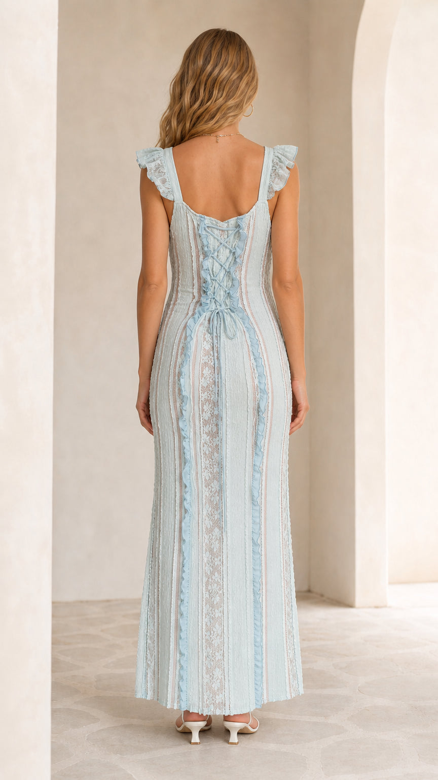 Back view showing lace-up details on light blue dress